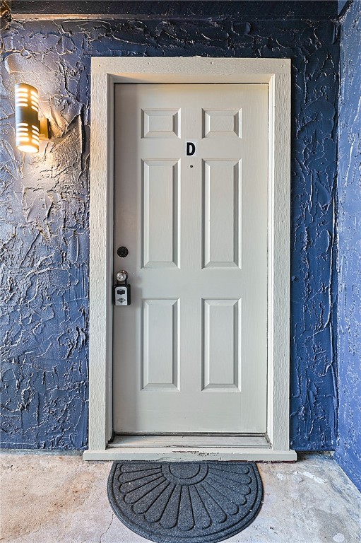 a view of entryway with a wooden door
