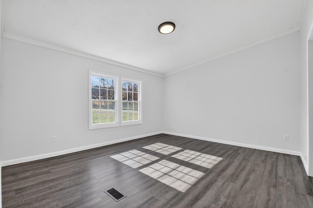 10967 Old Highway 76 Morganton, GA 30560 - Photo 18 of 31 an empty room with wooden floor and windows