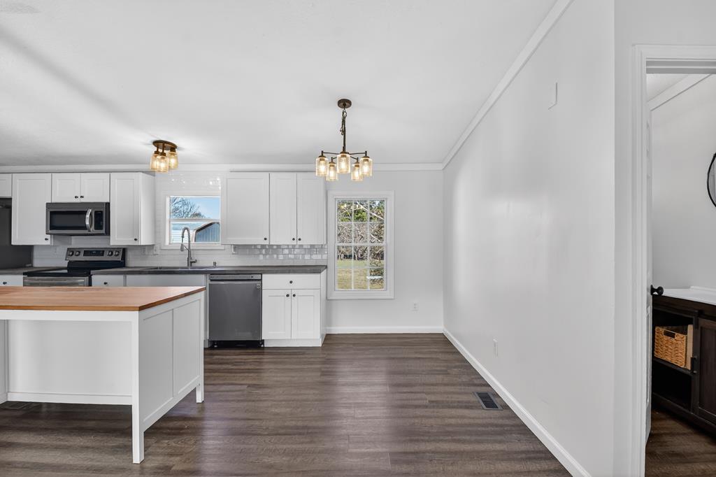 10967 Old Highway 76 Morganton, GA 30560 - Photo 7 of 31 a kitchen with a sink and wooden floor