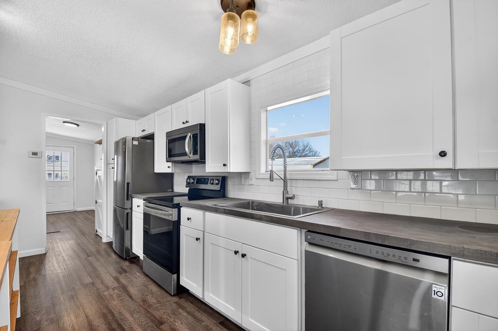 10967 Old Highway 76 Morganton, GA 30560 - Photo 9 of 31 a kitchen with a sink stove and microwave