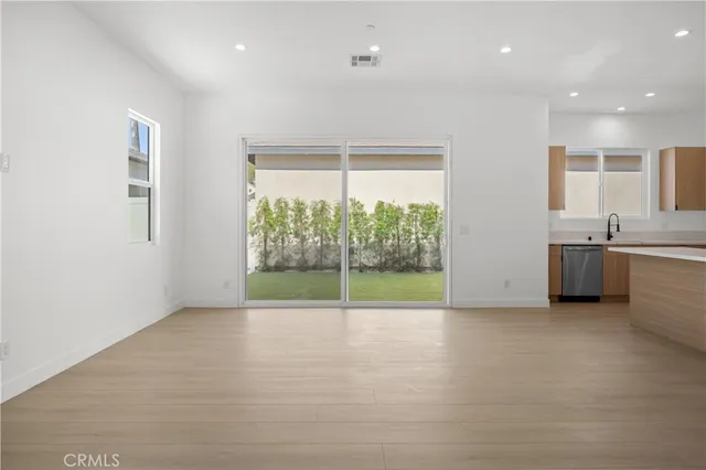 a view of a kitchen with a sink and a window