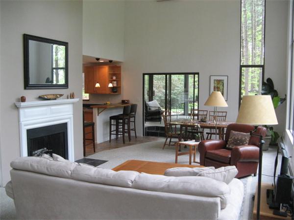 120 Still River Road Harvard, MA 01451 - Photo 2 of 22 a living room with furniture a large window and a fireplace