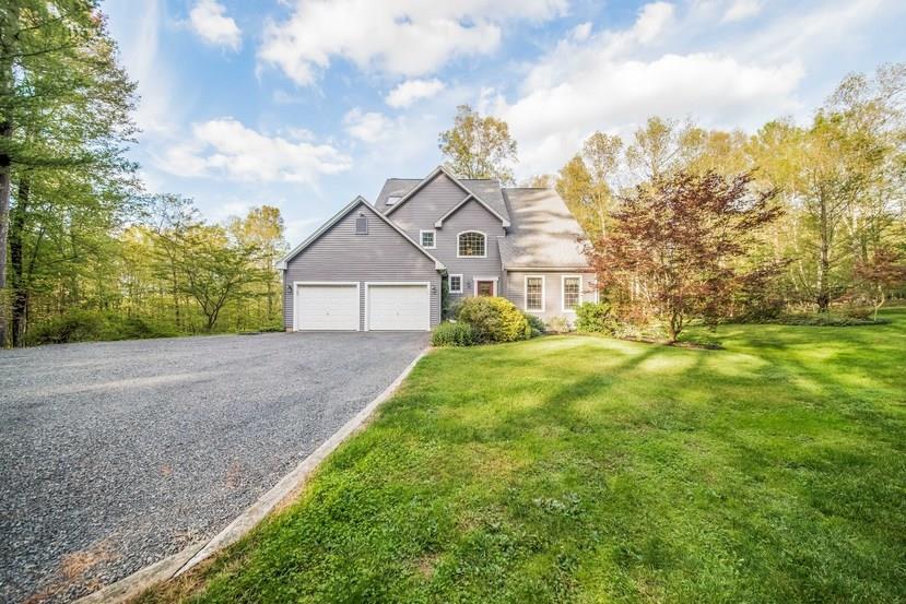 77 Gilbert Road Stafford, CT 06076 - Photo 1 of 1 a view of a big house with a big yard and large trees