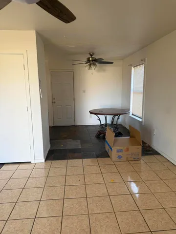 a view of an empty room and a window