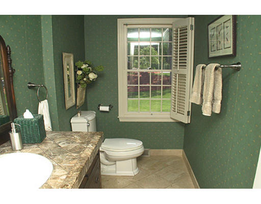 30 Virginia Ridge Road Sudbury, MA 01776 - Photo 15 of 23 a bathroom with a sink toilet and a mirror