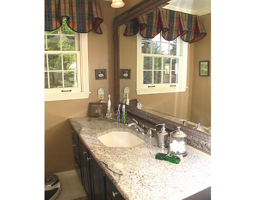 30 Virginia Ridge Road Sudbury, MA 01776 - Photo 16 of 23 a bathroom with a granite countertop sink a mirror and a shower