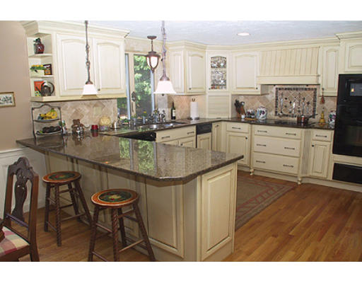 30 Virginia Ridge Road Sudbury, MA 01776 - Photo 2 of 23 a kitchen with kitchen island granite countertop a sink and cabinets