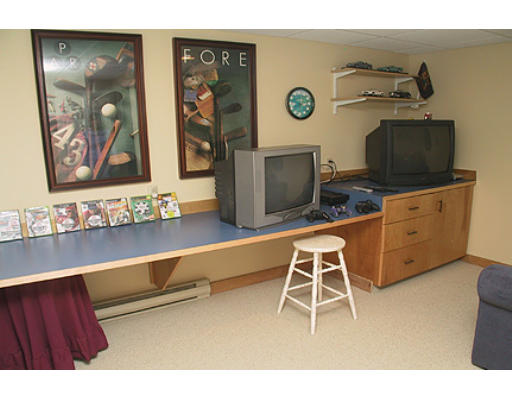 30 Virginia Ridge Road Sudbury, MA 01776 - Photo 10 of 23 a living room with furniture and a flat screen tv