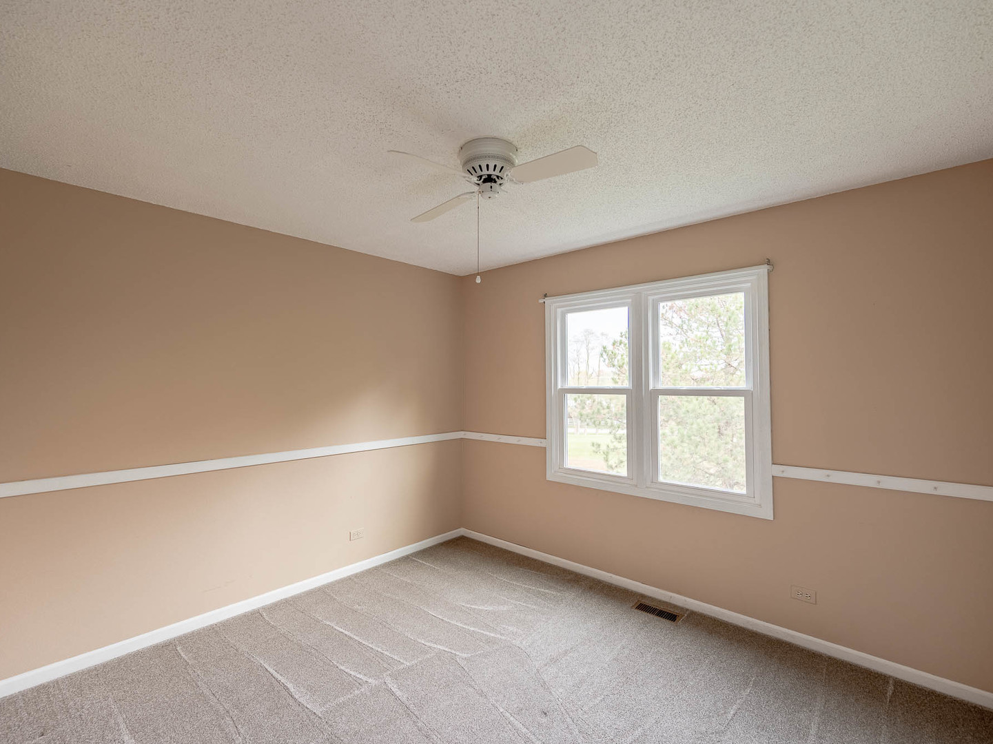 4 Candlewood Court Cary, IL 60013 - Photo 13 of 21 a view of an empty room with a window