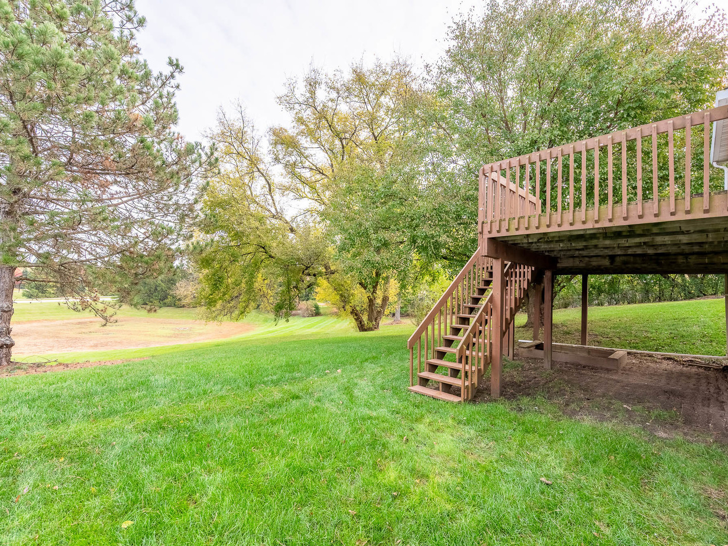 4 Candlewood Court Cary, IL 60013 - Photo 21 of 21 a view of a roof deck with a bench