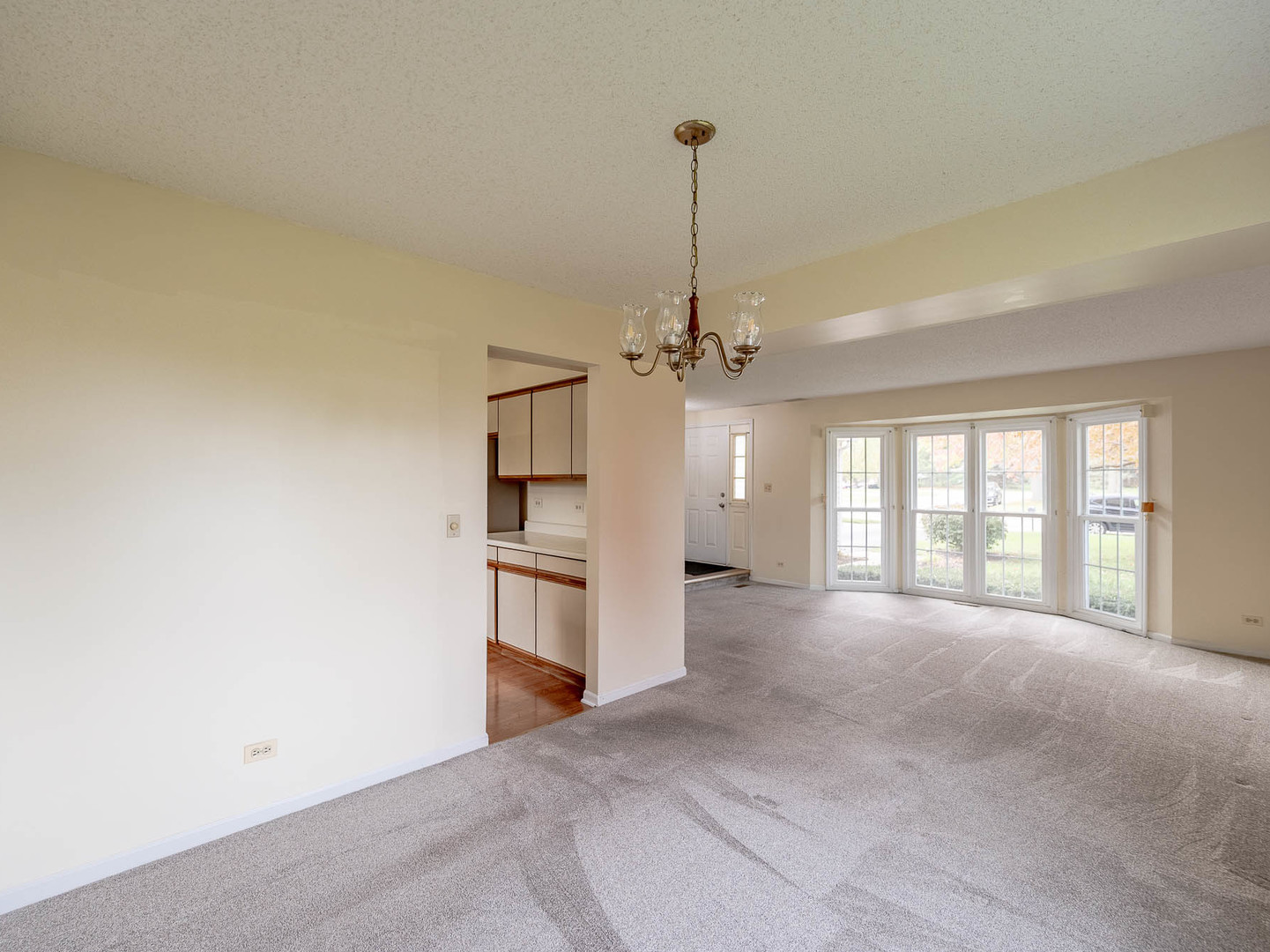 4 Candlewood Court Cary, IL 60013 - Photo 4 of 21 a view of an empty room with a window