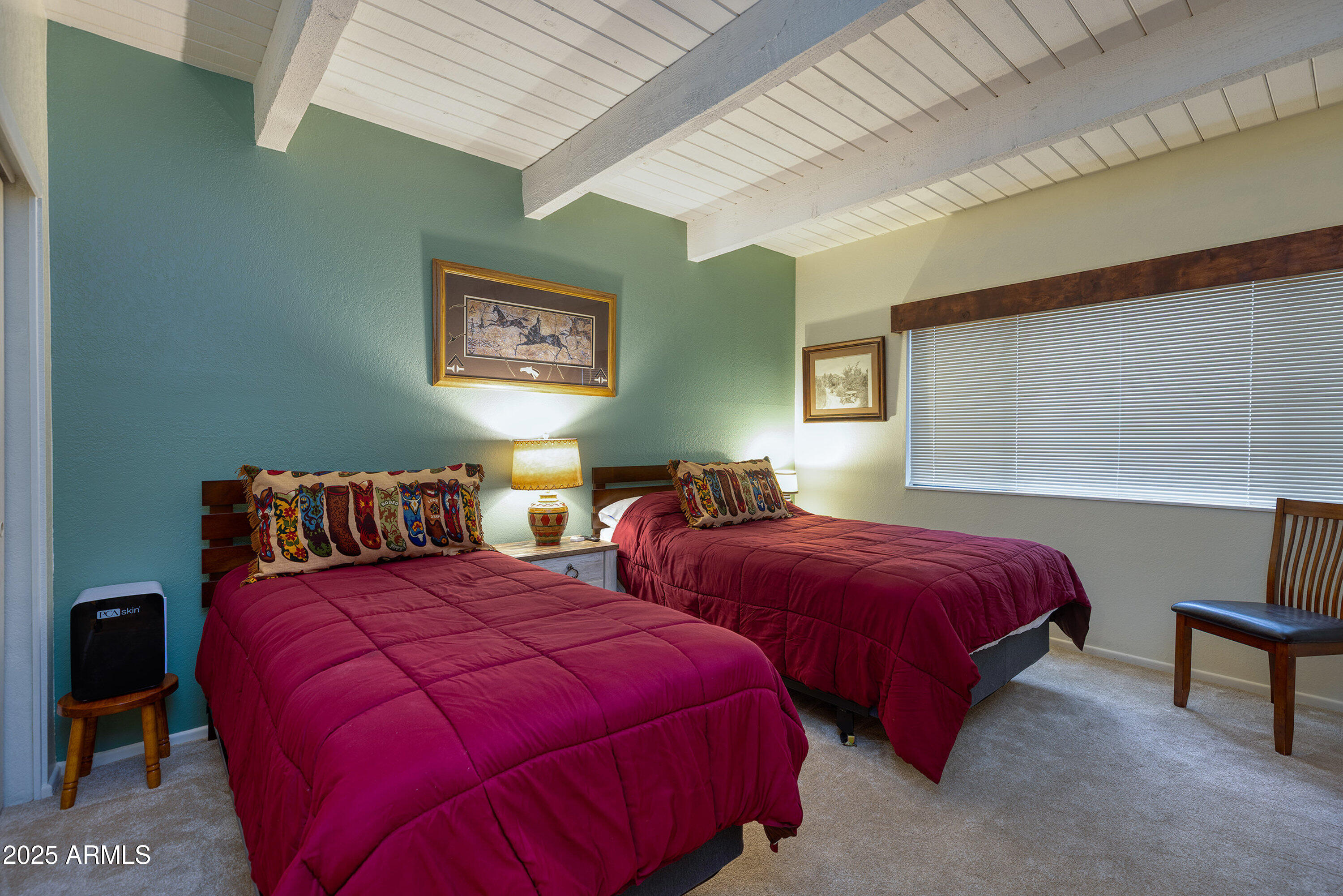 2641 Sports Village Loop, Unit 2 Pinetop, AZ 85935 - Photo 22 of 33 a bedroom with two beds and a lamp on dresser