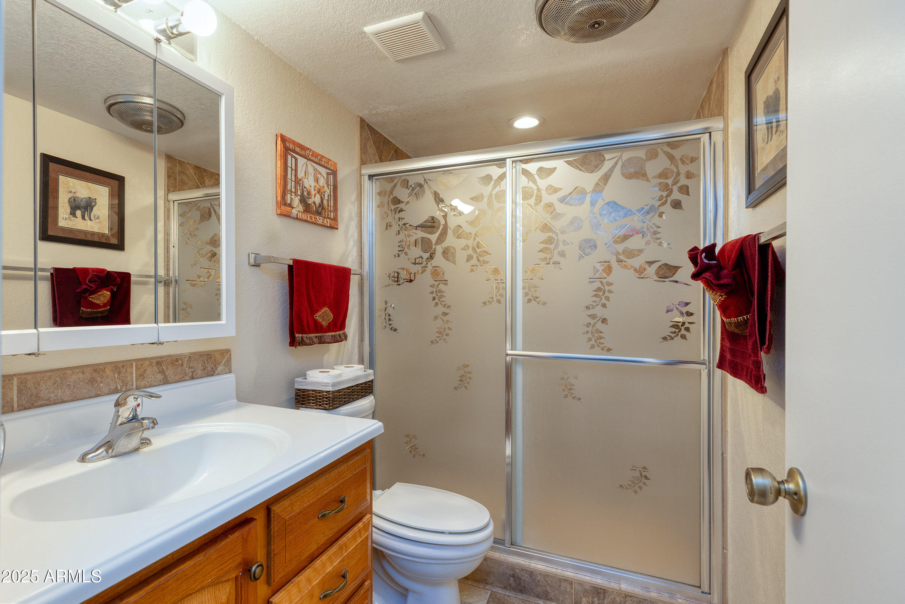 2641 Sports Village Loop, Unit 2 Pinetop, AZ 85935 - Photo 23 of 33 a bathroom with a sink toilet and shower