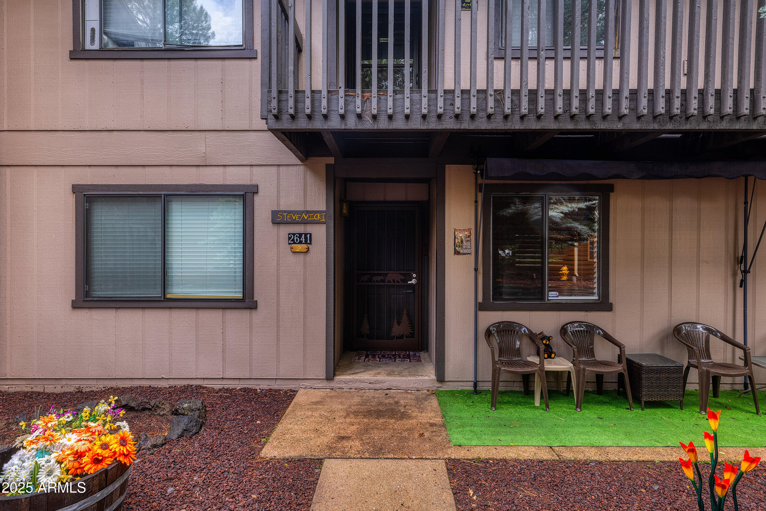 2641 Sports Village Loop, Unit 2 Pinetop, AZ 85935 - Photo 3 of 33 a front view of a house with garden
