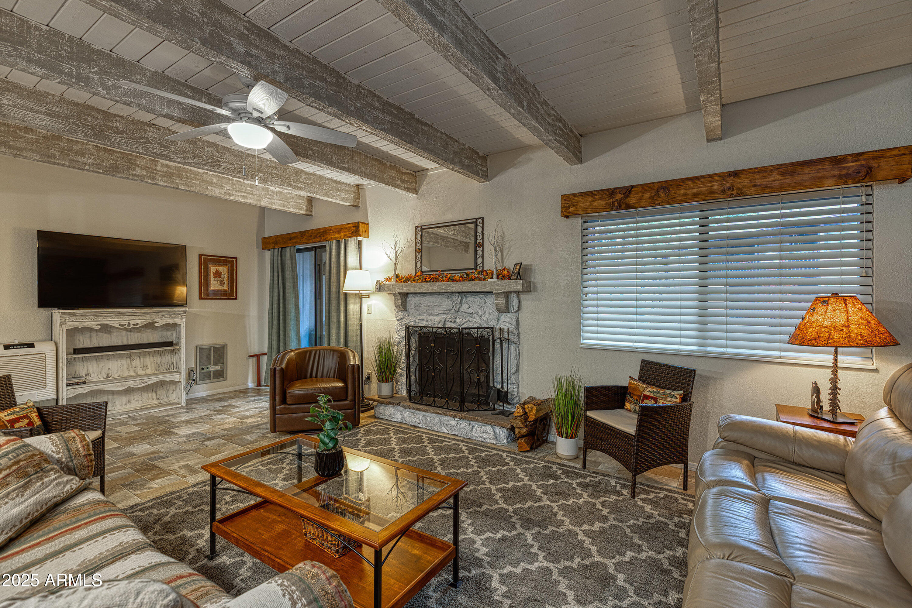 2641 Sports Village Loop, Unit 2 Pinetop, AZ 85935 - Photo 7 of 33 a living room with furniture a fireplace and a flat screen tv