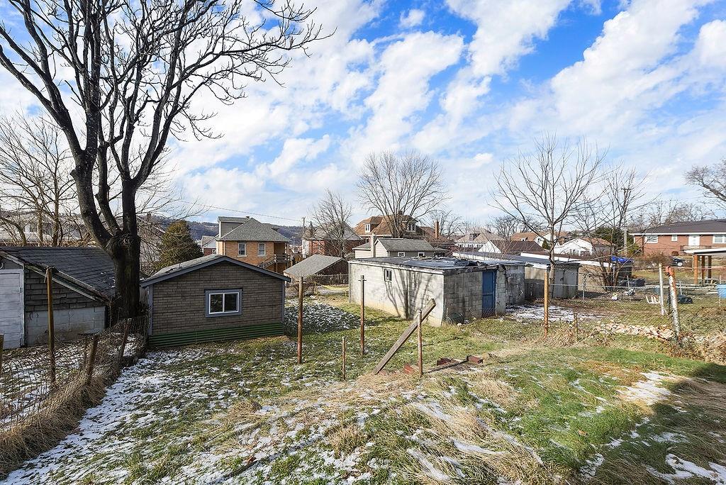 825 Pine Street Ambridge, PA 15003 - Photo 18 of 21 a front view of a house with a yard