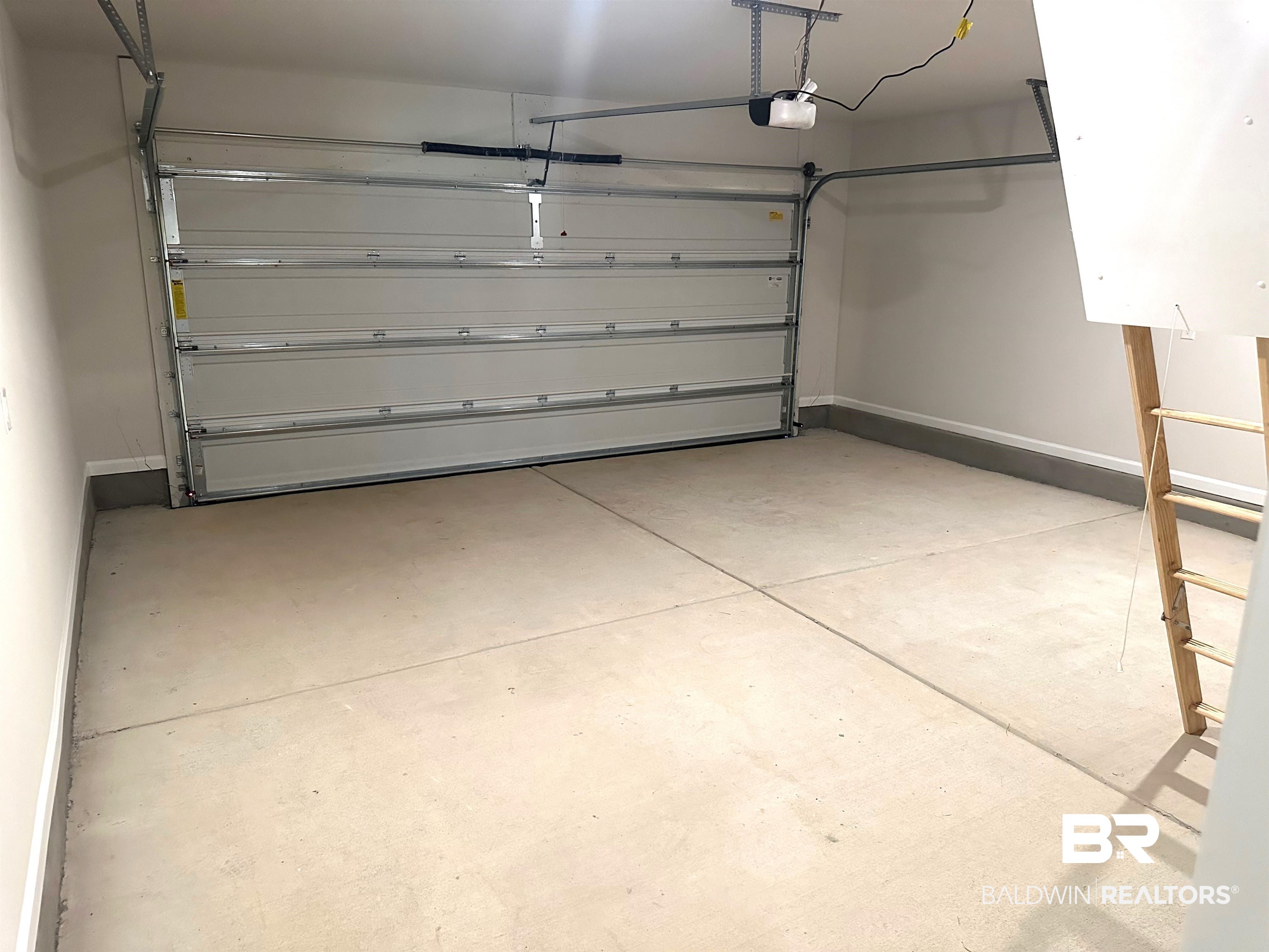 1227 Hayward Loop Foley, AL 36535 - Photo 23 of 29 Garage featuring a garage door opener