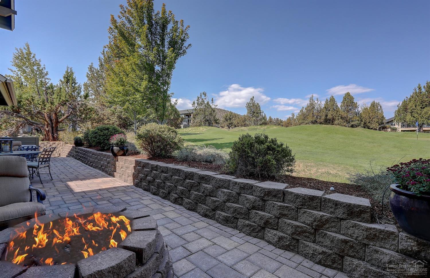 8915 Merlin Drive Redmond, OR 97756 - Photo 19 of 25 Enjoy the fire while you watch the golfe