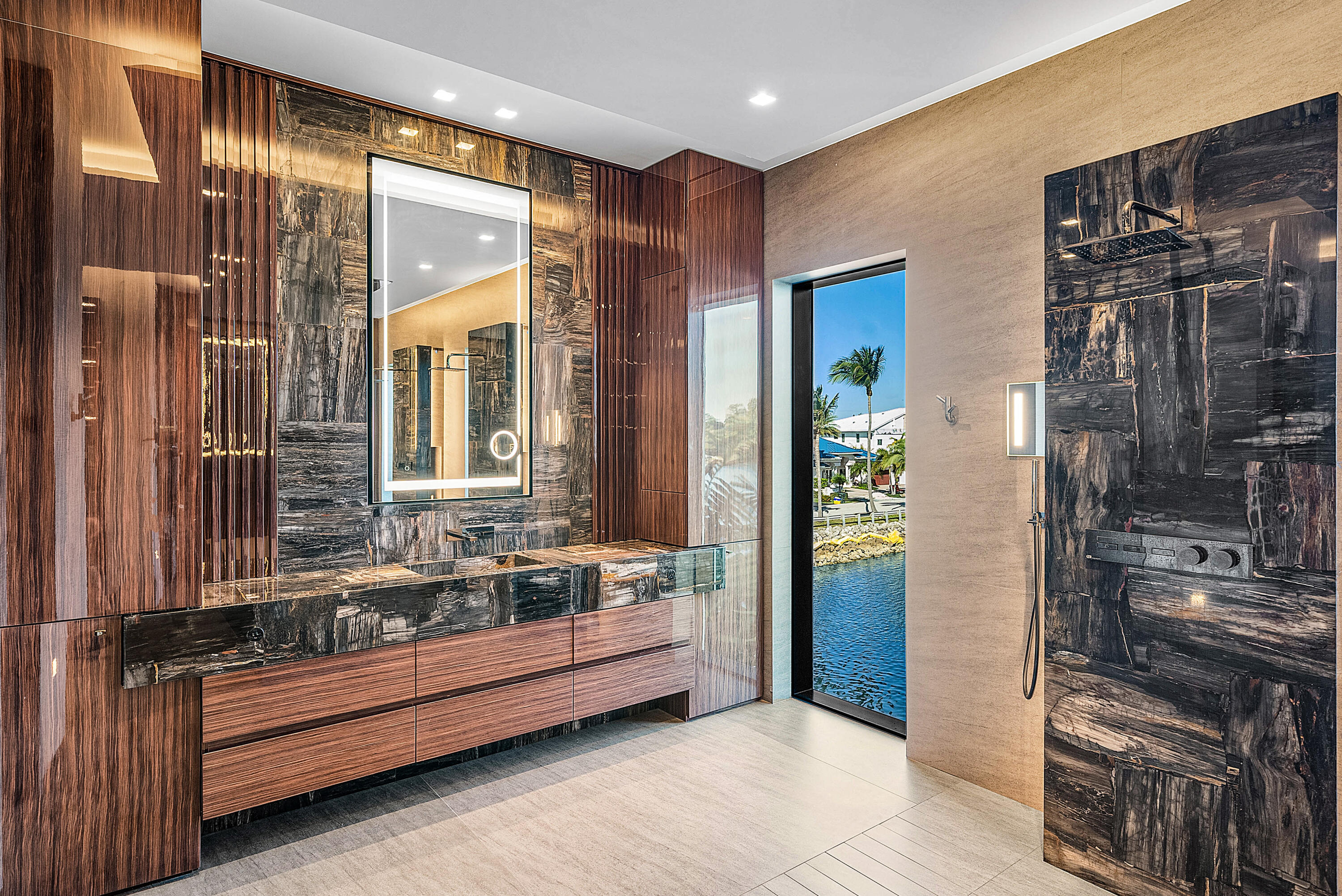 2934 Northeast 8th Avenue Boca Raton, FL 33431 - Photo 75 of 116 a bathroom with a double vanity sink and a bathtub