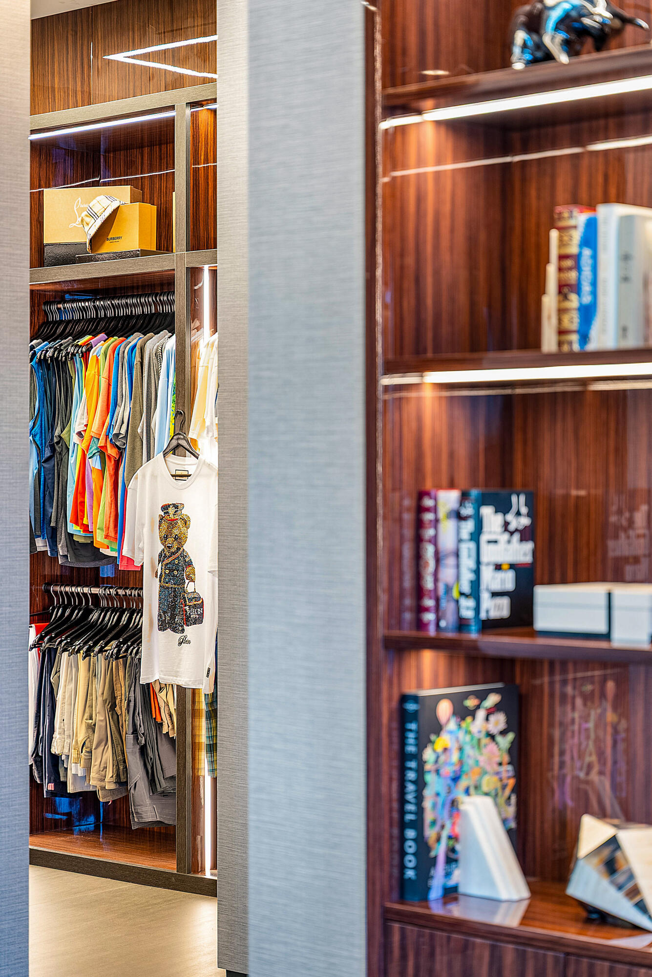 2934 Northeast 8th Avenue Boca Raton, FL 33431 - Photo 77 of 116 a view of walk in closet with clothes and shoes