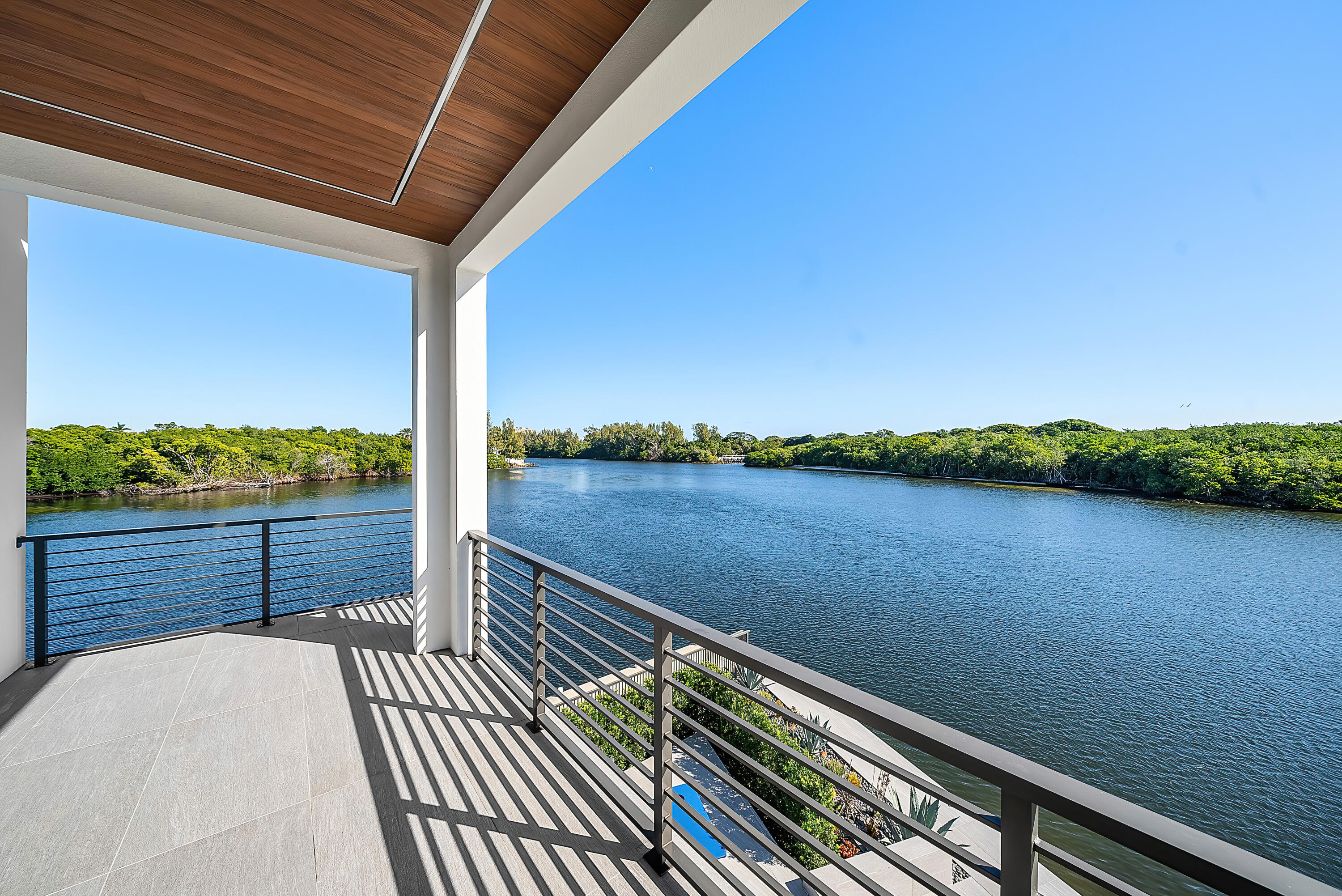 2934 Northeast 8th Avenue Boca Raton, FL 33431 - Photo 85 of 116 a view of balcony with wooden floor and lake view