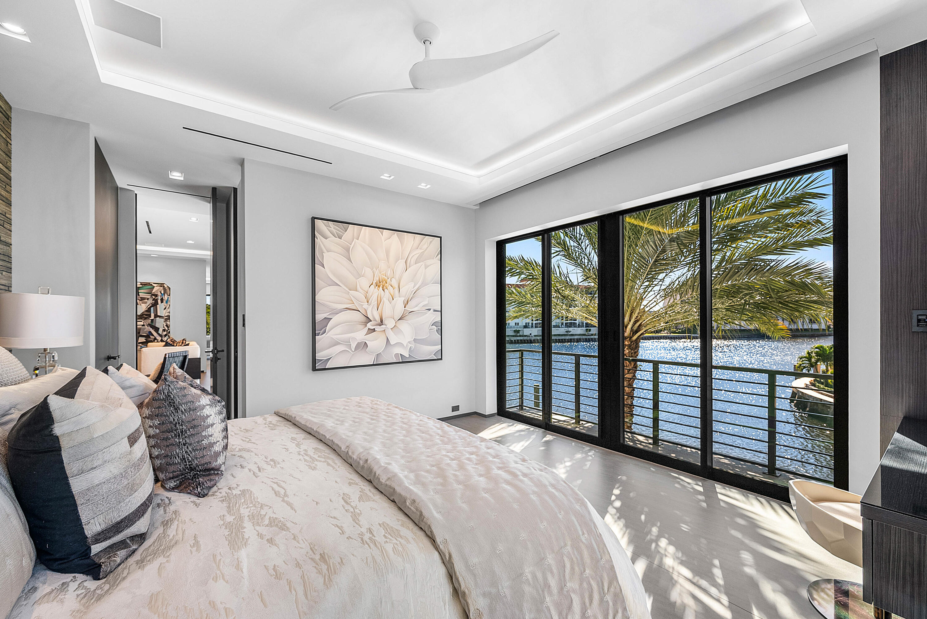 2934 Northeast 8th Avenue Boca Raton, FL 33431 - Photo 90 of 116 a bedroom with a large bed and a large window