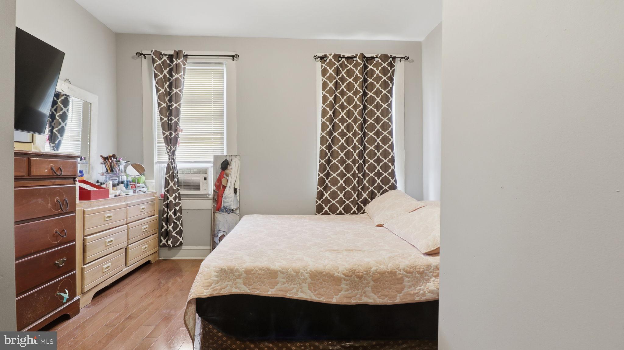 211 Fagley Street Baltimore, MD 21224 - Photo 12 of 16 a bedroom with a bed and a window