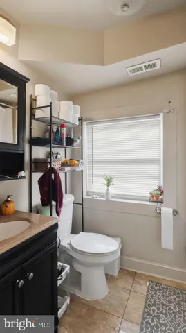 a bedroom with a bed and flat screen tv