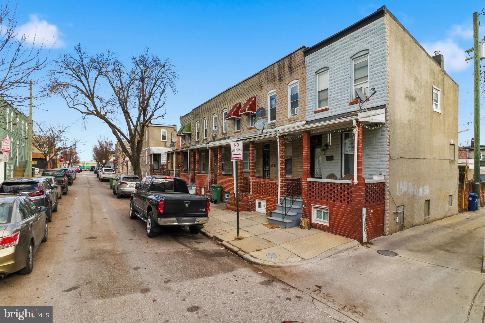 211 Fagley Street Baltimore, MD 21224 - Photo 3 of 16 a view of a street with cars