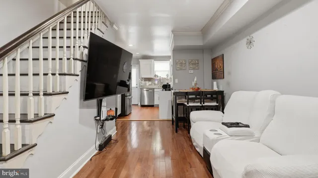 a kitchen with a refrigerator and a sink