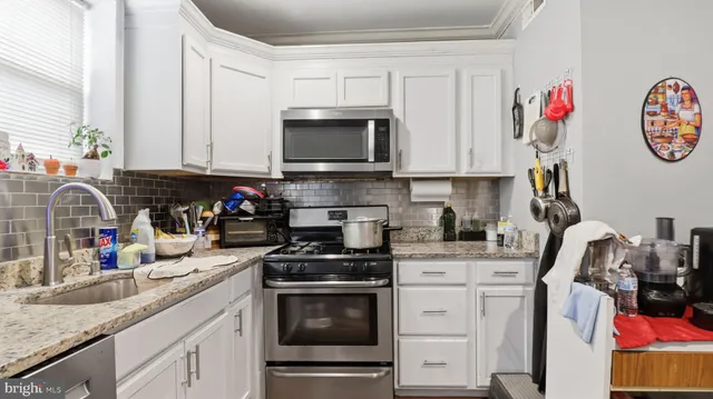 a bedroom with a bed and a cabinets
