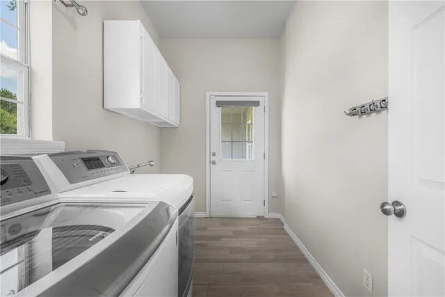 a front view of a house with a yard and a garage