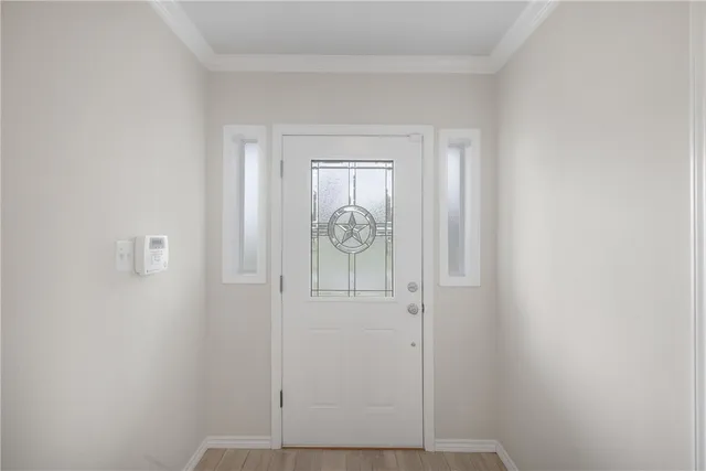 a kitchen with stainless steel appliances kitchen island hardwood floor sink and stove