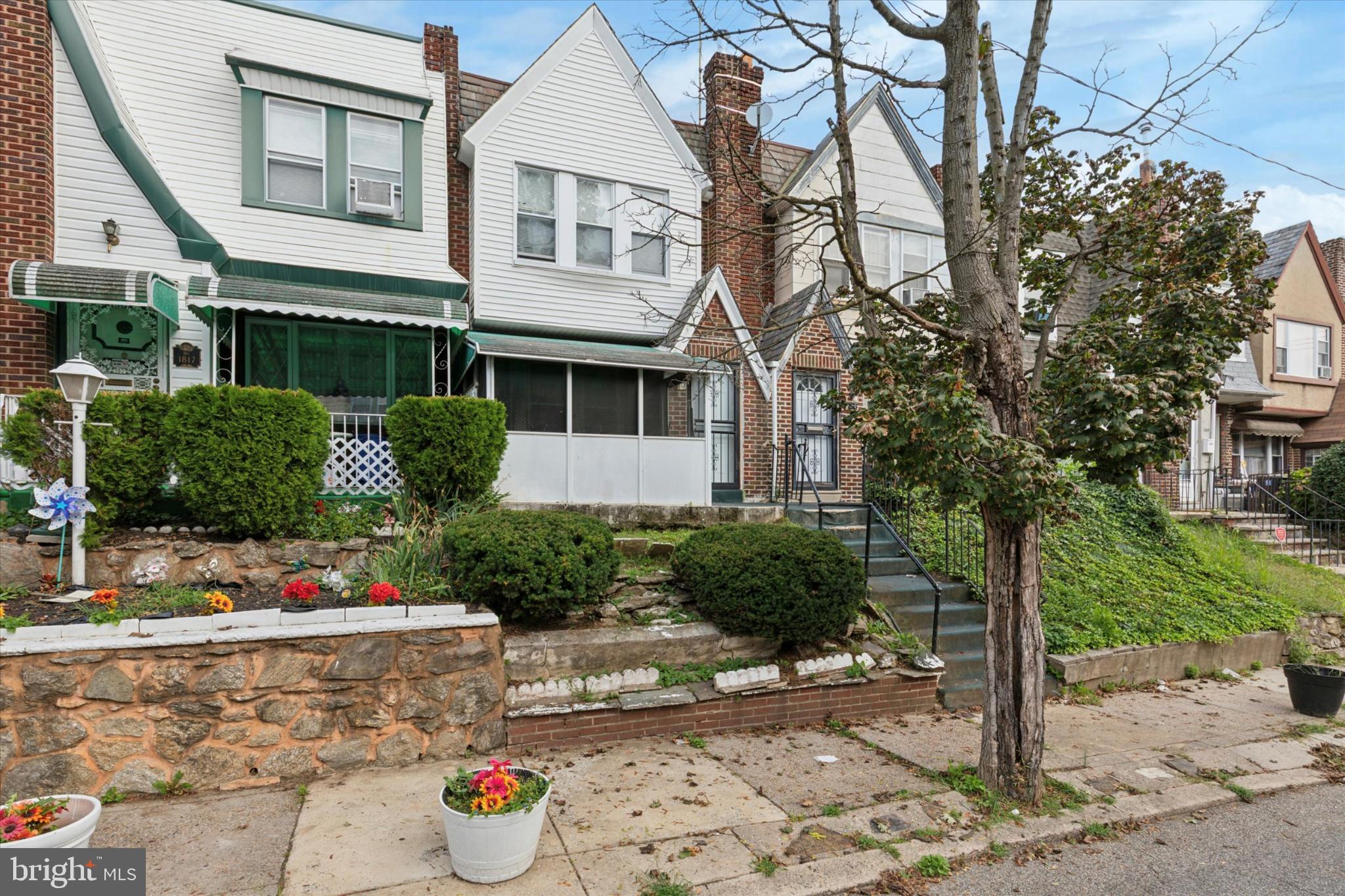 1815 Elston Street Philadelphia, PA 19126 - Photo 1 of 14 Charming row homes with lush greenery.