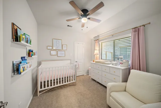 a bed room with a bed and a large window