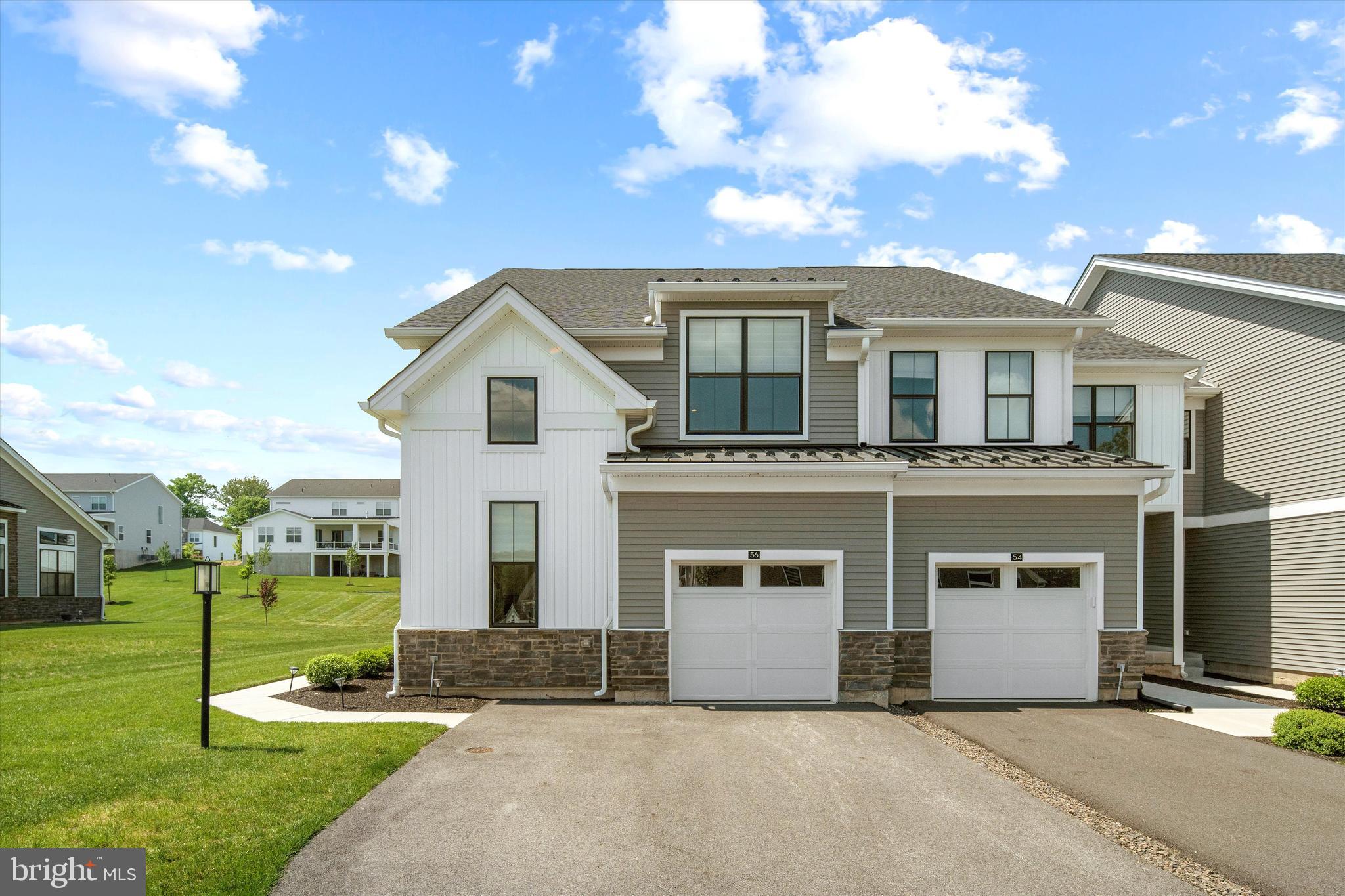 front view of a house with a yard