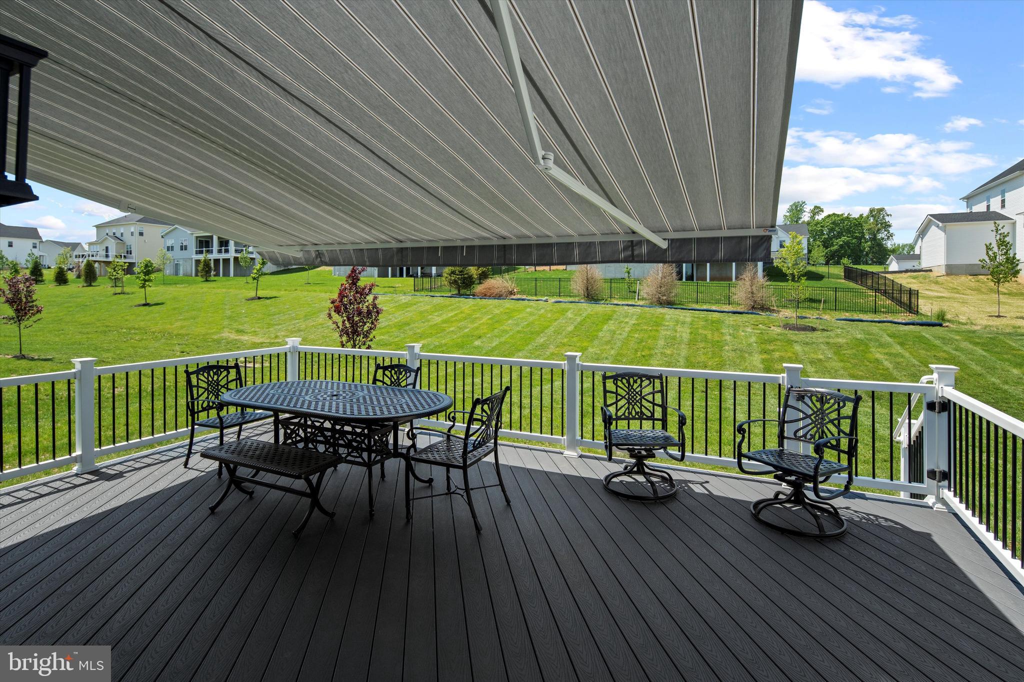 56 Umbrell Drive Eagleville, PA 19403 - Photo 11 of 28 a view of a chairs and table on the wooden deck