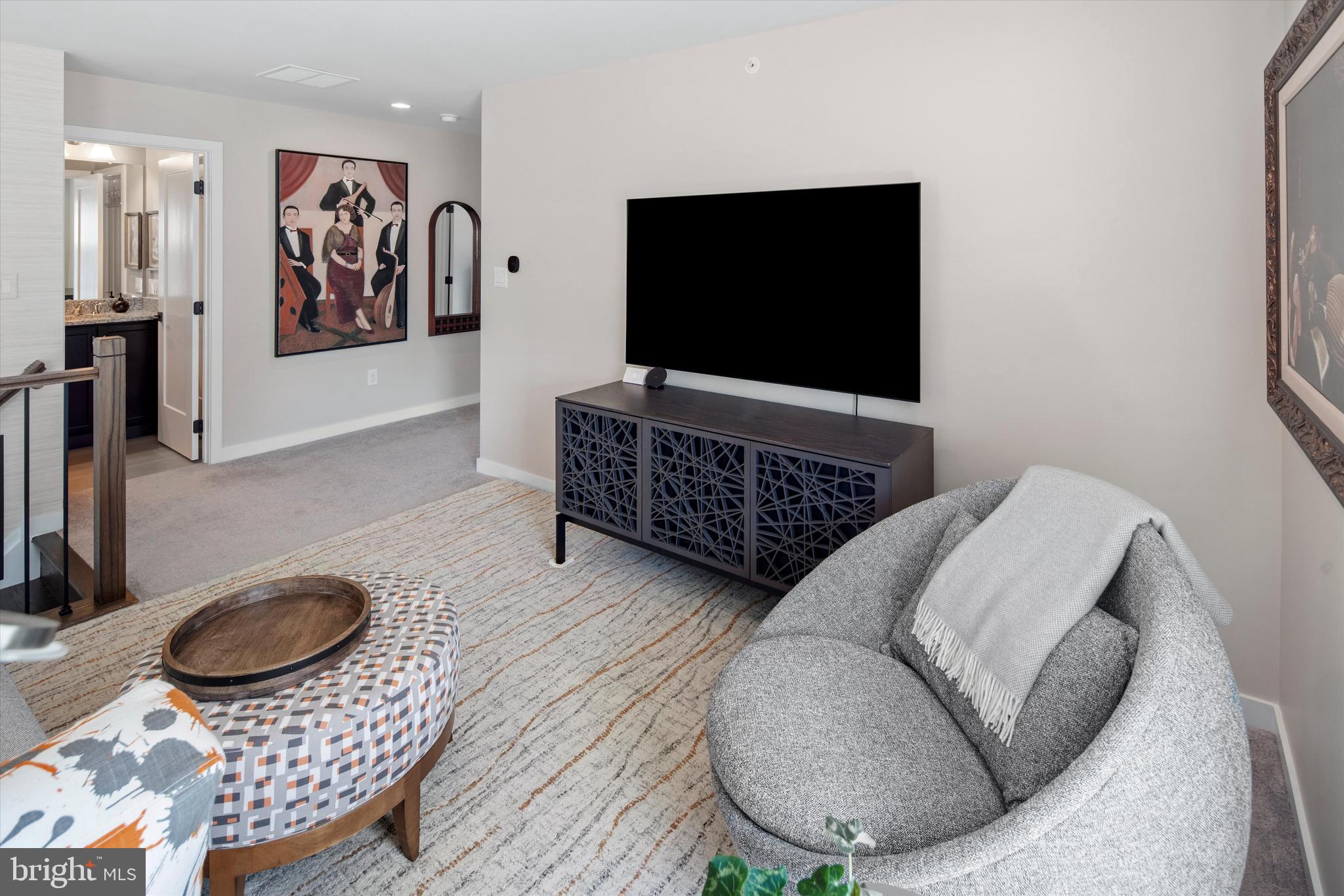 56 Umbrell Drive Eagleville, PA 19403 - Photo 20 of 28 a living room with furniture and a flat screen tv