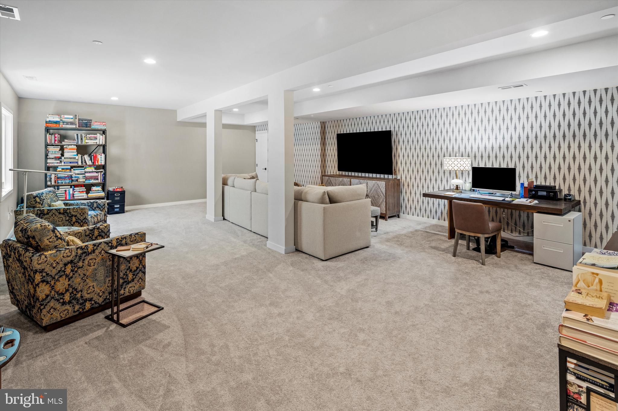 56 Umbrell Drive Eagleville, PA 19403 - Photo 26 of 28 a living room with furniture a flat screen tv and a fireplace