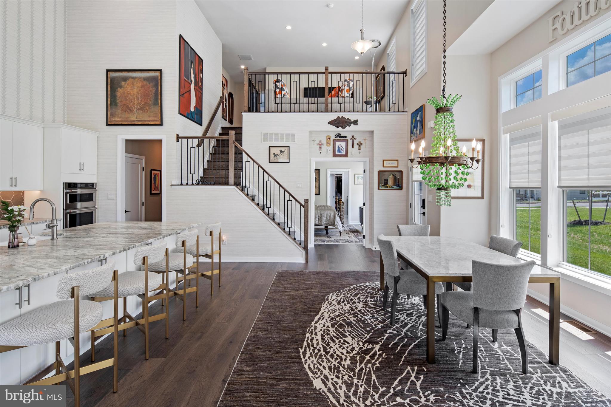 56 Umbrell Drive Eagleville, PA 19403 - Photo 5 of 28 a living room with furniture a flat screen tv and a table
