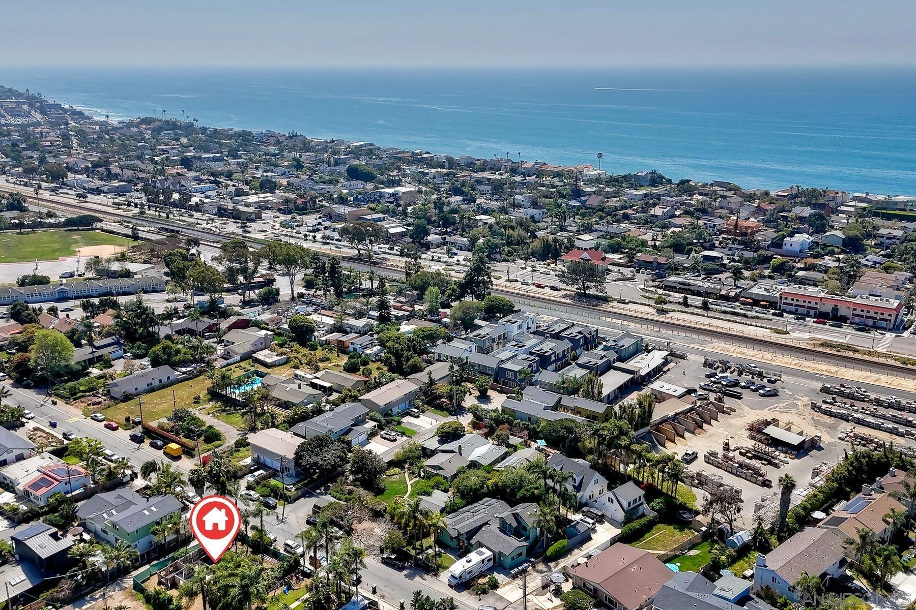 569 Hermes Avenue Encinitas, CA 92024 - Photo 7 of 16 an aerial view of a city with lots of residential buildings and ocean view in back