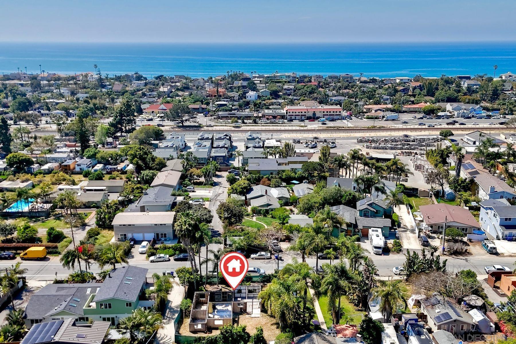 569 Hermes Avenue Encinitas, CA 92024 - Photo 8 of 16 an aerial view of a city with lots of residential buildings and ocean view in back