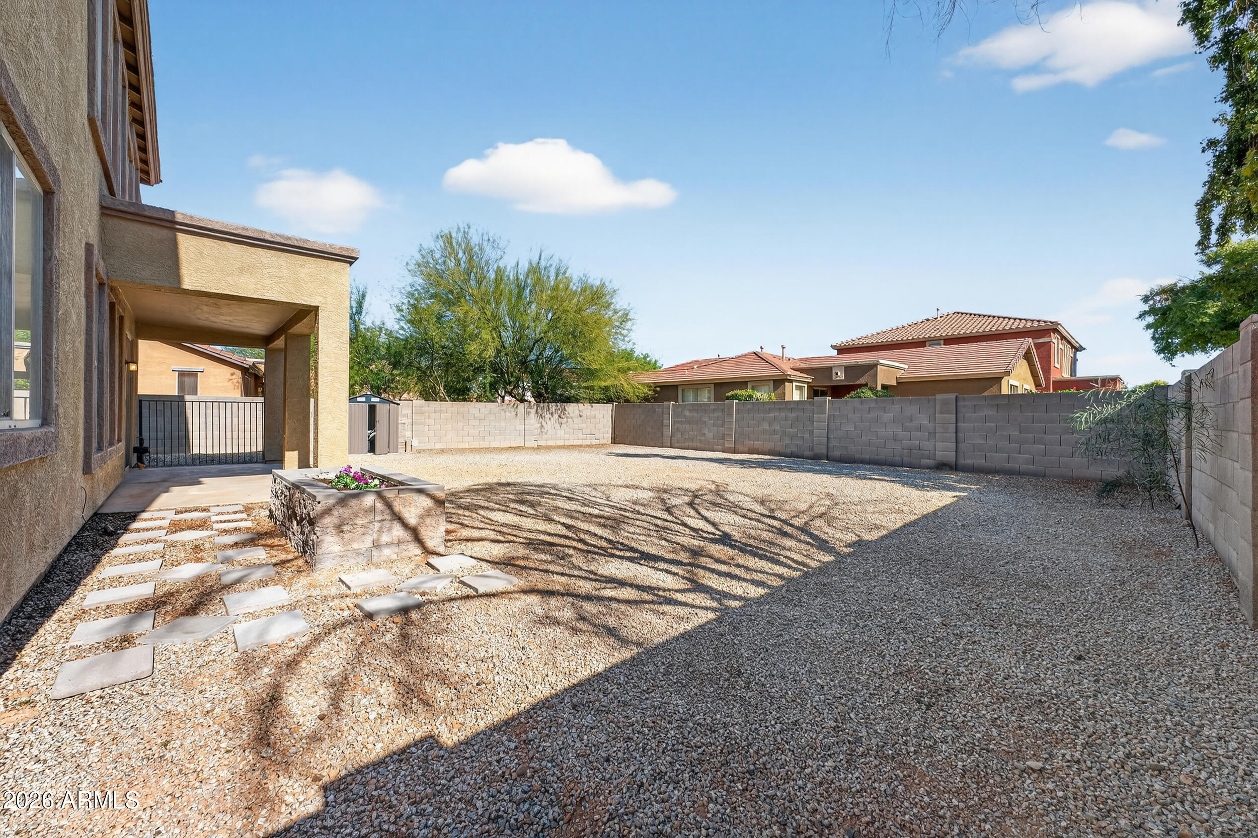 4199 North 154th Drive Goodyear, AZ 85395 - Photo 16 of 17 a view of a backyard of a house