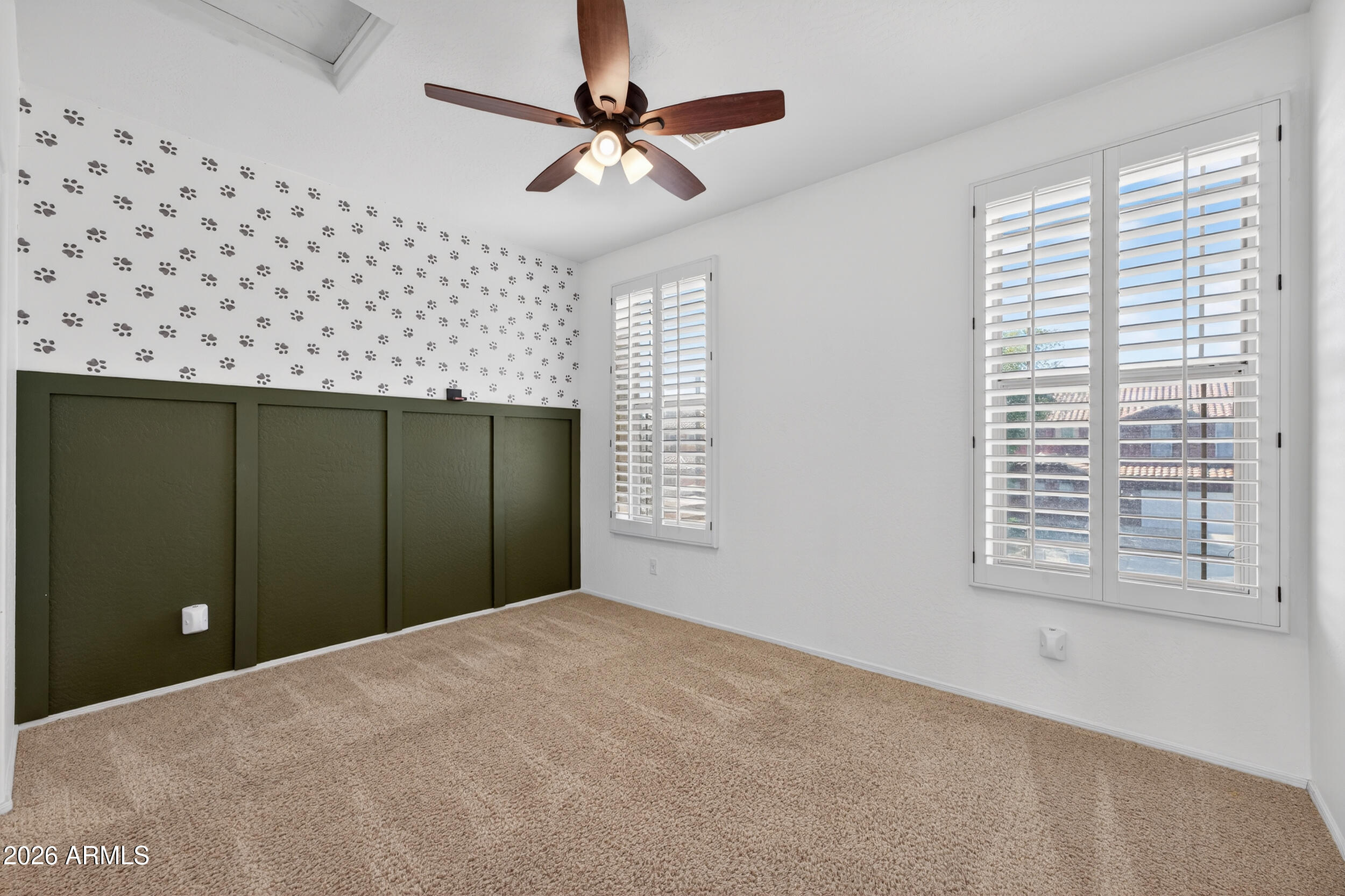 4199 North 154th Drive Goodyear, AZ 85395 - Photo 8 of 17 a view of a livingroom with a ceiling fan and a window
