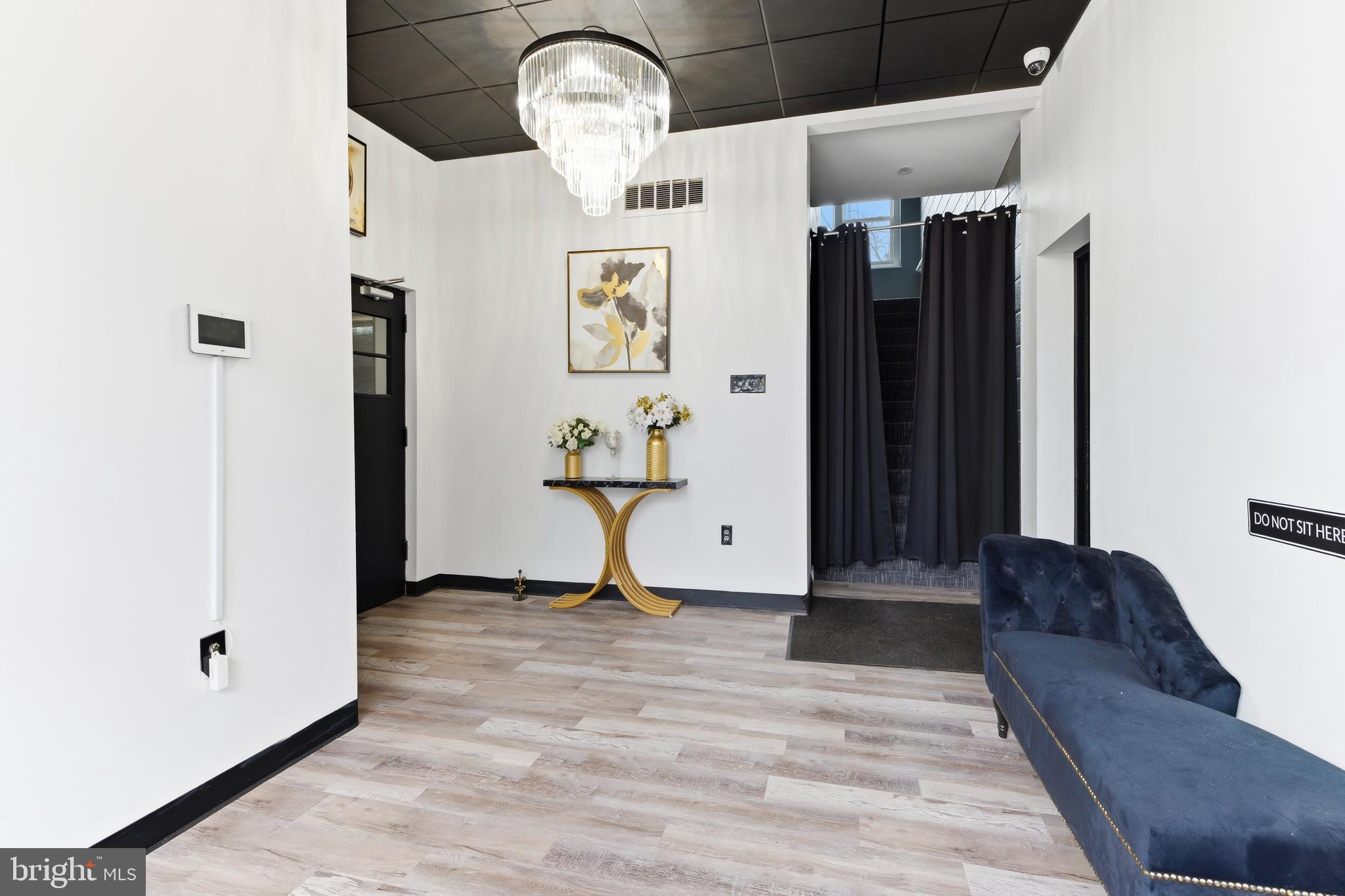 201 Broadway, Unit RES A Westville, NJ 08093 - Photo 2 of 11 a view of empty room with wooden floor