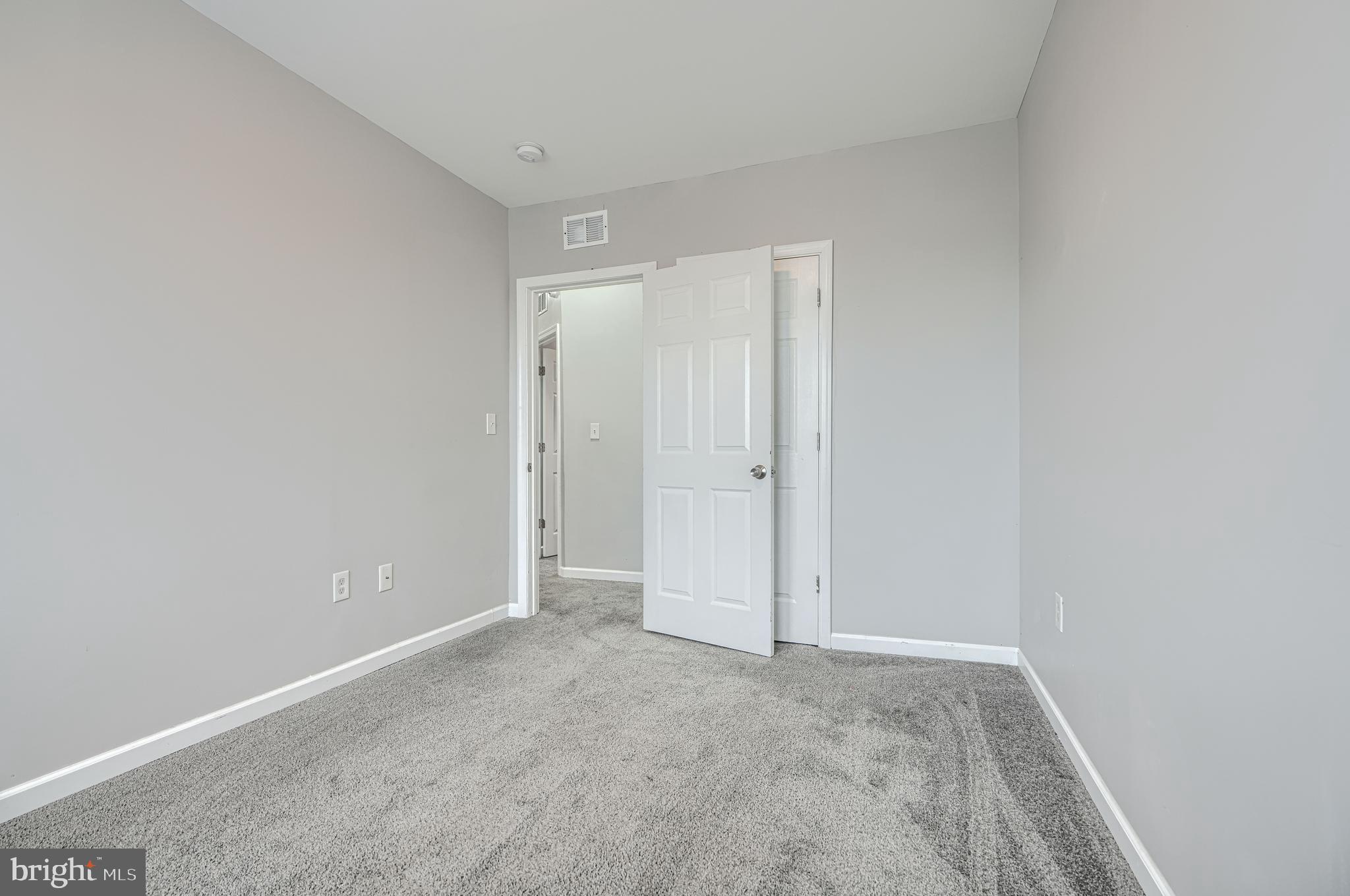 1702 East 32nd Street Baltimore, MD 21218 - Photo 17 of 38 a view of an empty room