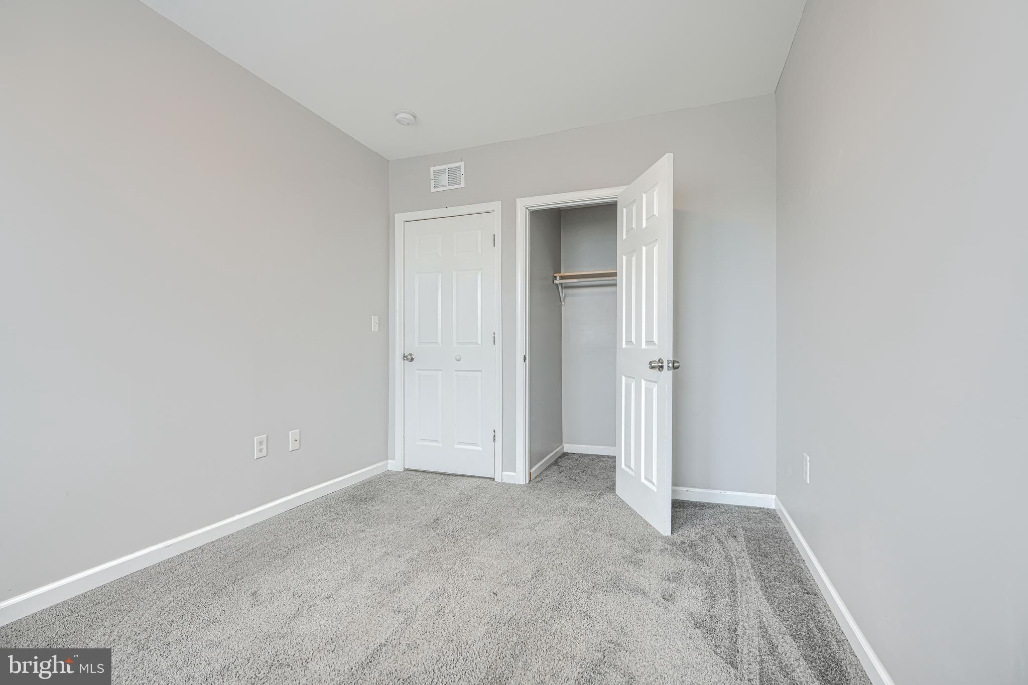 1702 East 32nd Street Baltimore, MD 21218 - Photo 18 of 38 a view of an empty room