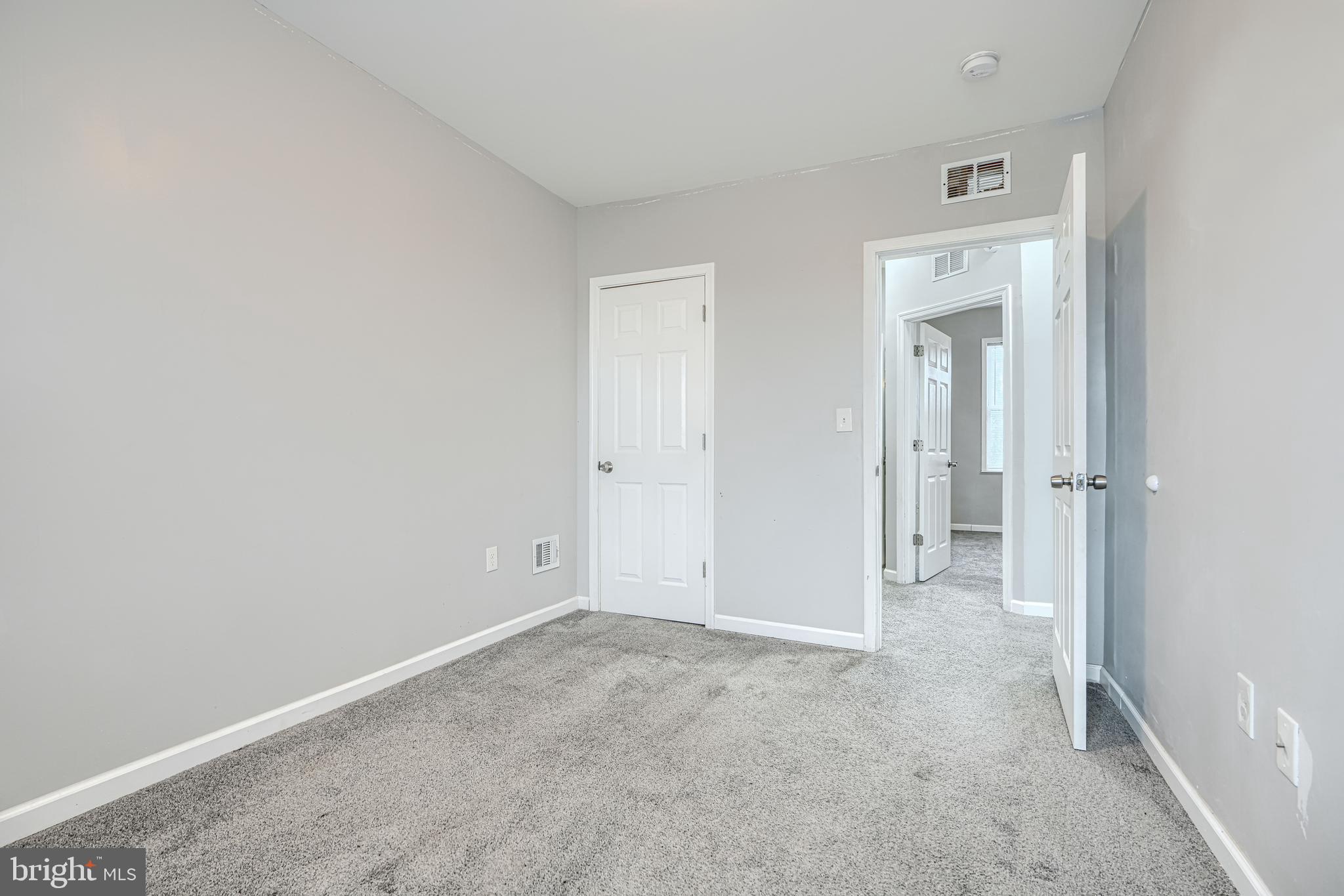 1702 East 32nd Street Baltimore, MD 21218 - Photo 20 of 38 an empty room with closet area