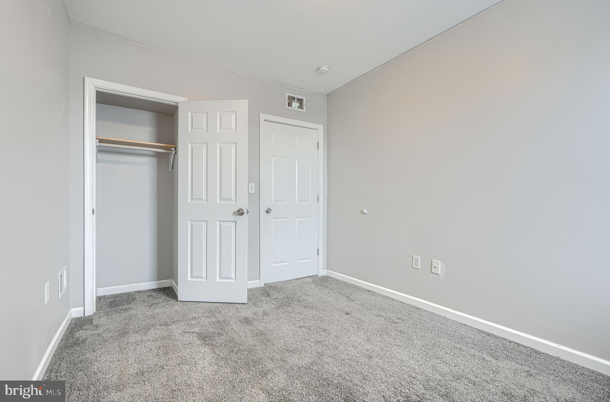 1702 East 32nd Street Baltimore, MD 21218 - Photo 21 of 38 an empty room with closet area