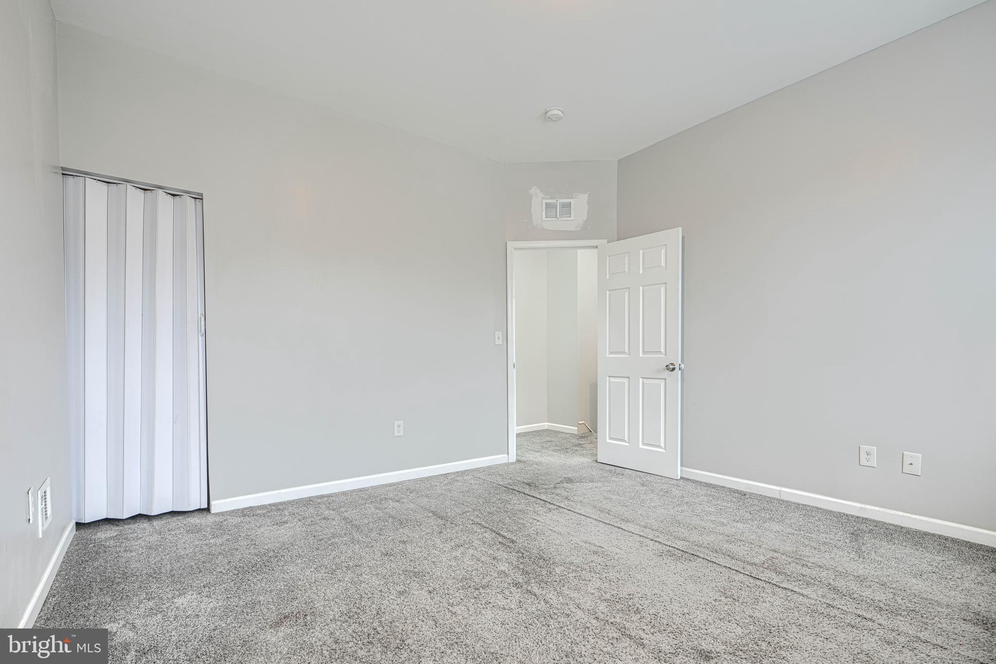 1702 East 32nd Street Baltimore, MD 21218 - Photo 23 of 38 a view of an empty room